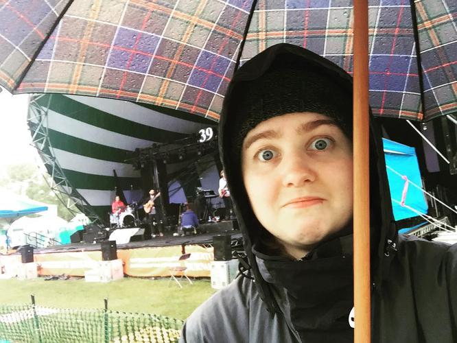 Trying to keep dry on the last day of folk fest. Trying.