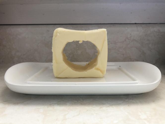 For the first time in my life, I've been fooled. Dylan slowly carved the centre of a block of butter out, waiting...